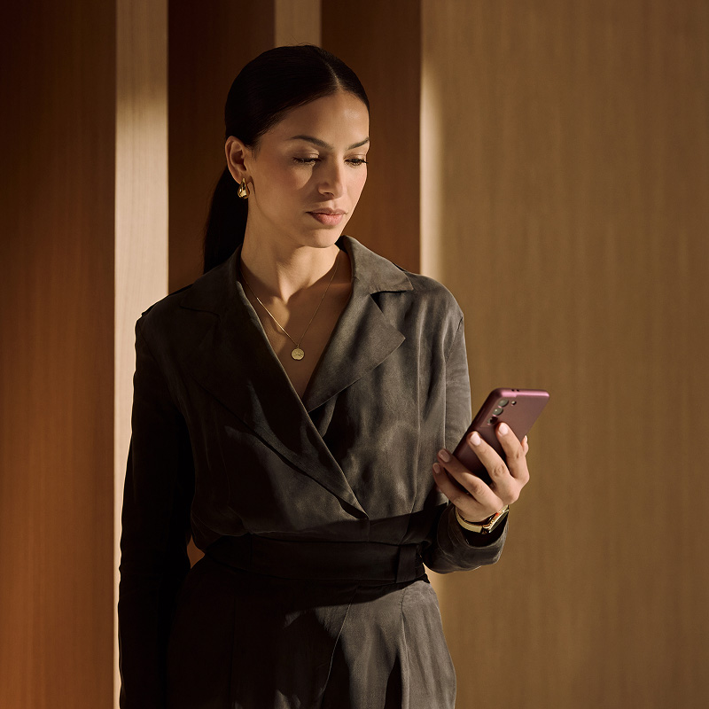 woman using phone in office